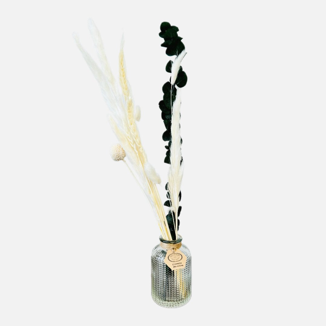 Dried flowers in a Raphael bottle