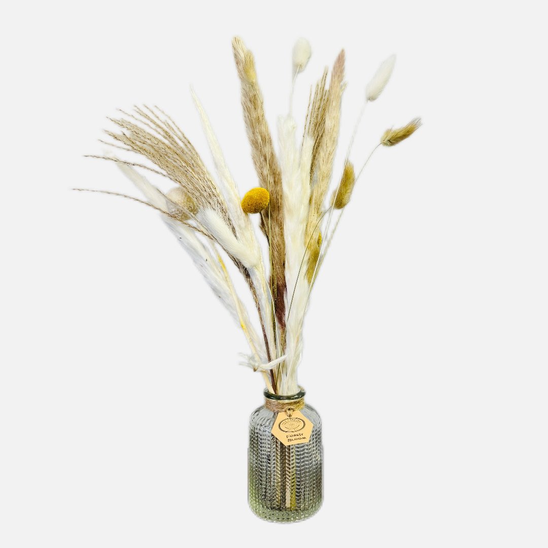 Dried flowers in a Raphael bottle