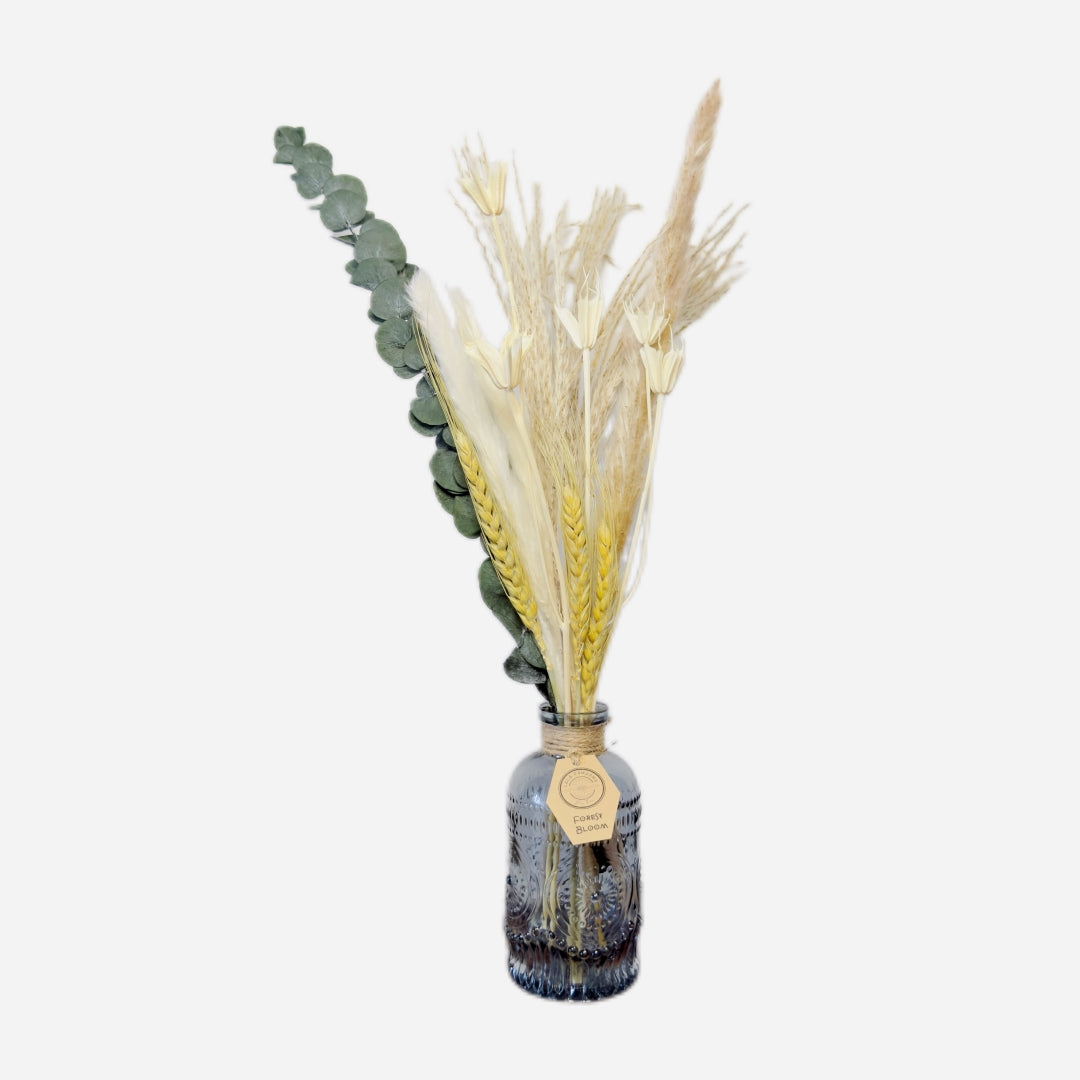 Dried flowers in a Roy bottle